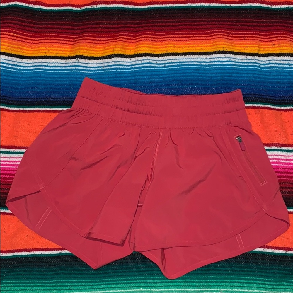 red lululemon tracker shorts 4”